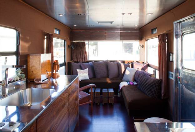 Among the cultivated furnishings are a pair of rosewood tables from Blackman Cruz and an English Art Deco bar cabinet.
